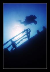 Diver checking out the upper deck of a wreck off the coas... by Johannes Felten 